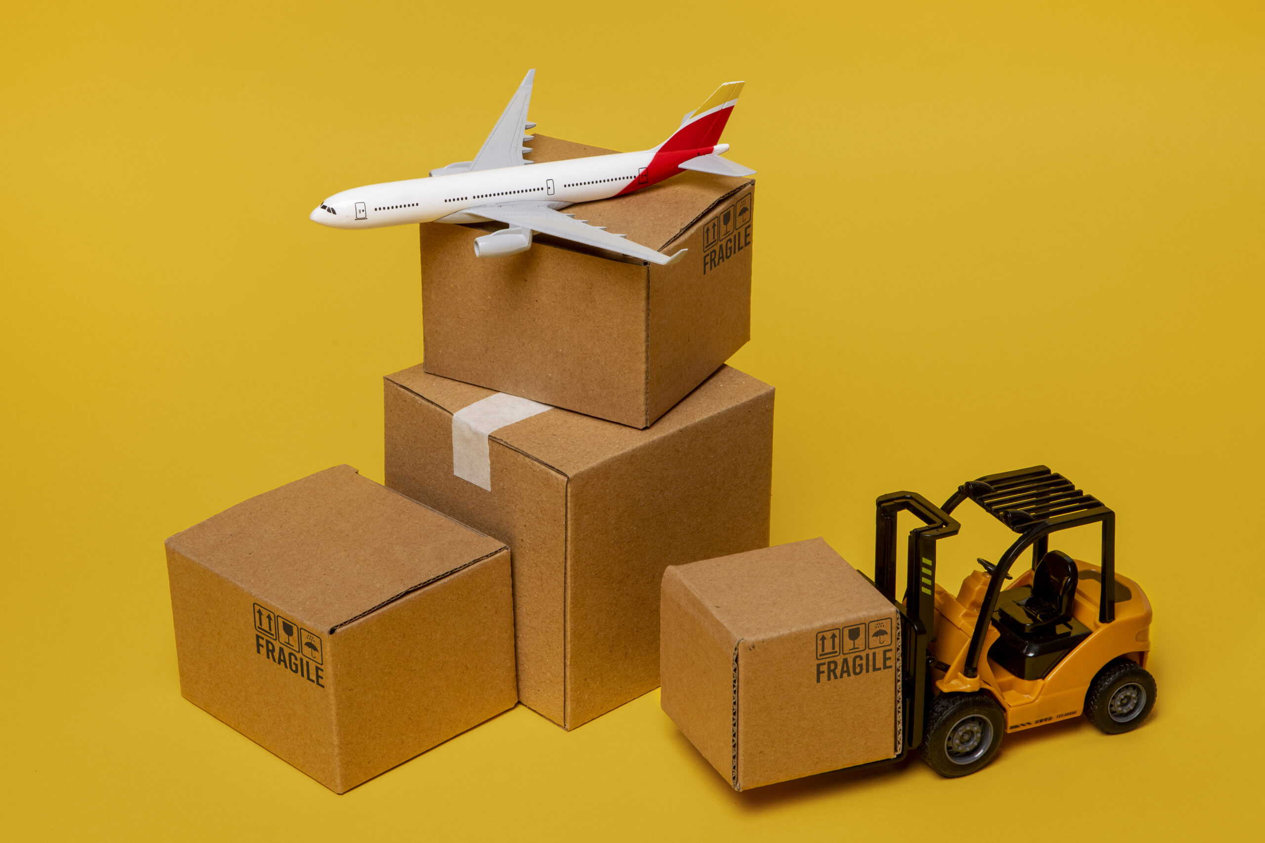 Cartons measured with a tape for CBM calculation before loading a 20ft container
