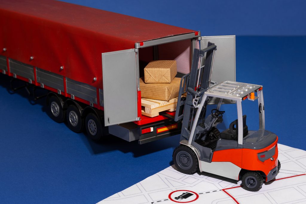 Full truckload of palletised cargo being loaded onto a lorry