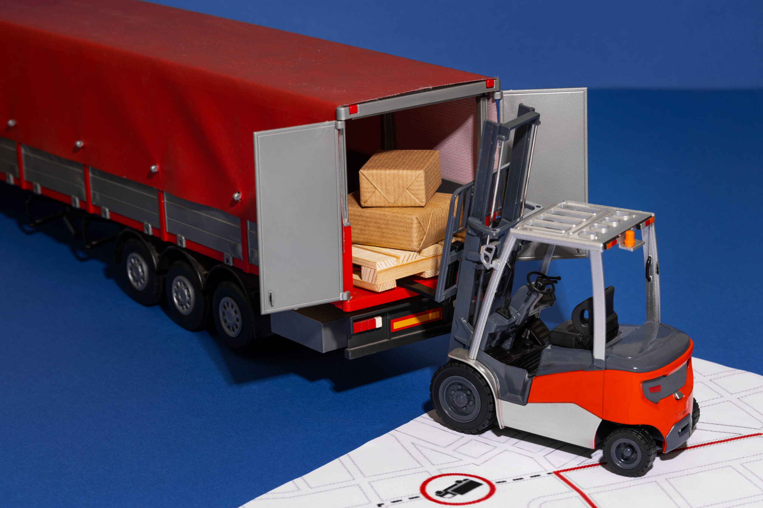 Full truckload of palletised cargo being loaded onto a lorry